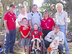 Liam with his assistance dog and the Aussie Pooch Mobile team. Liam with his assistance dog and the Aussie Pooch Mobile team.